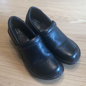 B.O.C black leather clogs.